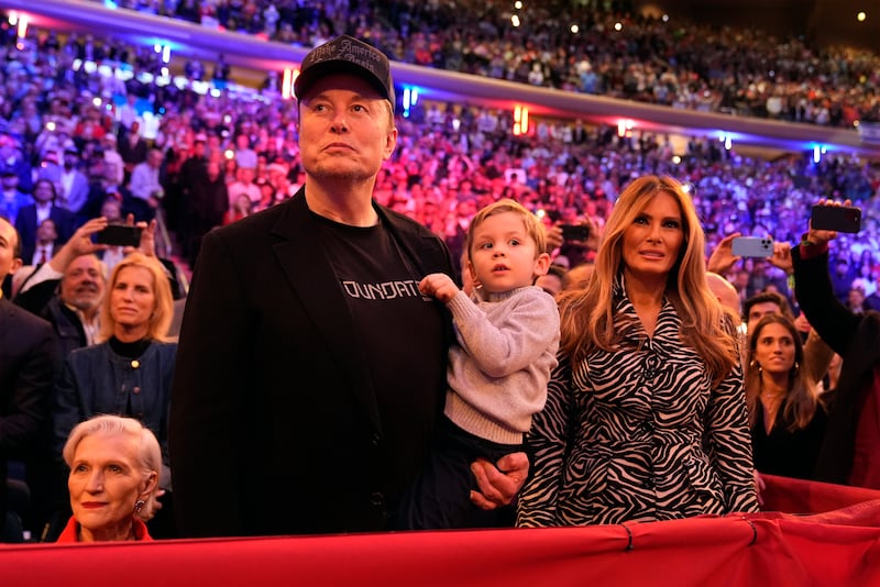 Elon Musk and Melania Trump listen as Donald Trump speaks at a campaign rally at Madison Square Garden in New York (Alex Brandon/AP)