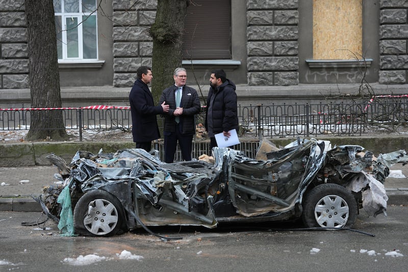 Prime Minister Sir Keir Starmer inspects a damaged vehicle in Kyiv