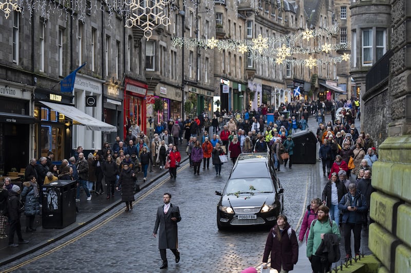 People line the streets as Janey Godley’s hearse travels through Edinburgh