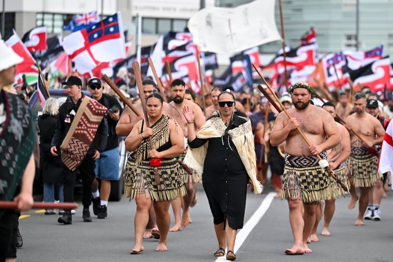 Maori people walk through the streets of Wellington, (Mark Tantrum/AP)