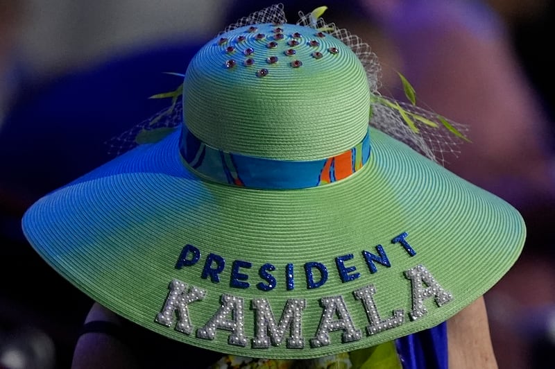 A woman wears a Kamala Harris hat during the Democratic National Convention (Charles Rex Arbogast/AP)