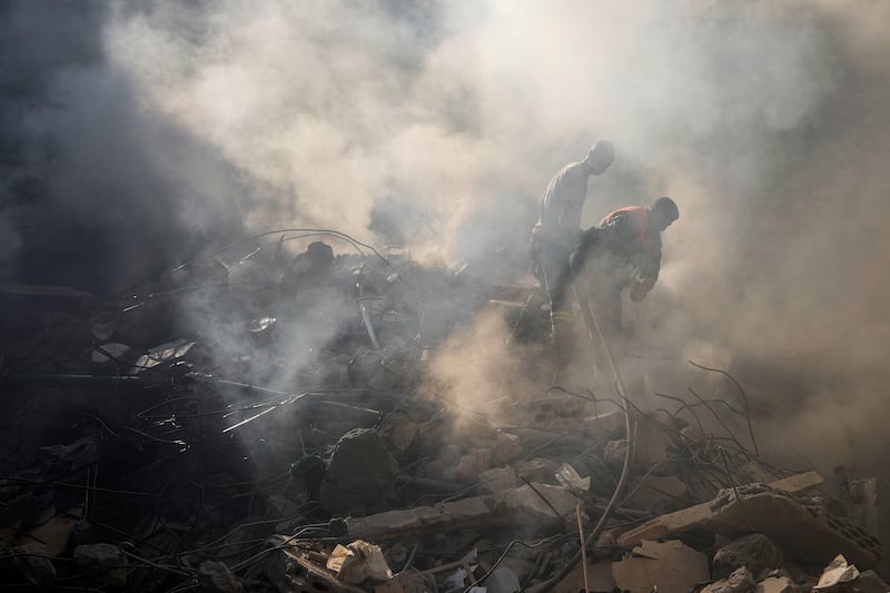 Rescue workers search for victims at the site of Thursday’s Israeli airstrike in Beirut, Lebanon (Hassan Ammar/AP)