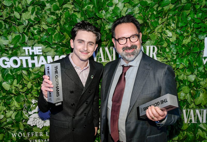 Timothee Chalamet, left, and James Mangold pose with the visionary tribute award for A Complete Unknown during The Gothams Film Awards (Evan Agostini/Invision/AP)