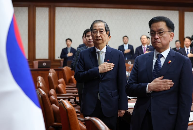 South Korea’s Prime Minister Han Duck-soo, second from right, became the country’s acting leader after President Yoon Suk Yeol’s impeachment (Yonhap via AP)