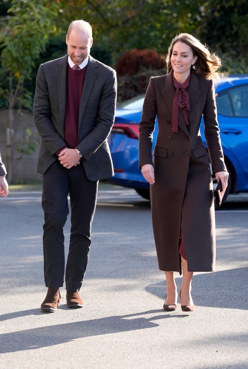 The Prince and Princess of Wales matched in espresso browns and rich plums