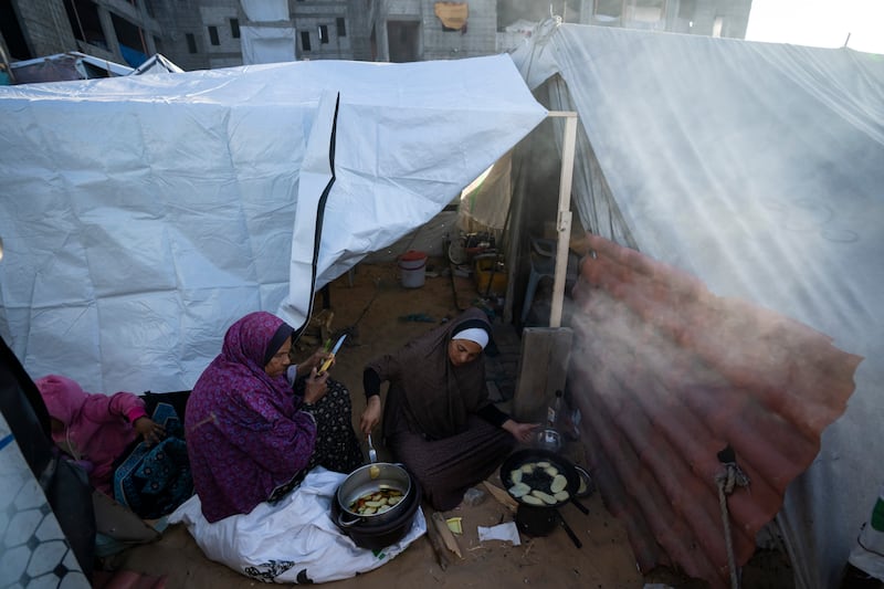 Palestinians in a makeshift tent camp in the Muwasi area (Fatima Shbair/AP)