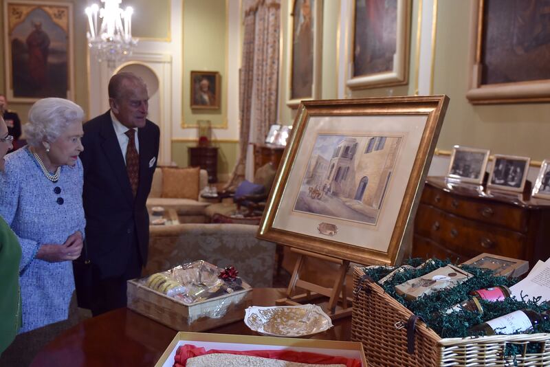 The Queen and Philip in 2015, receiving a painting of Villa Guardamangia, the house in Malta where they stayed as a young married couple