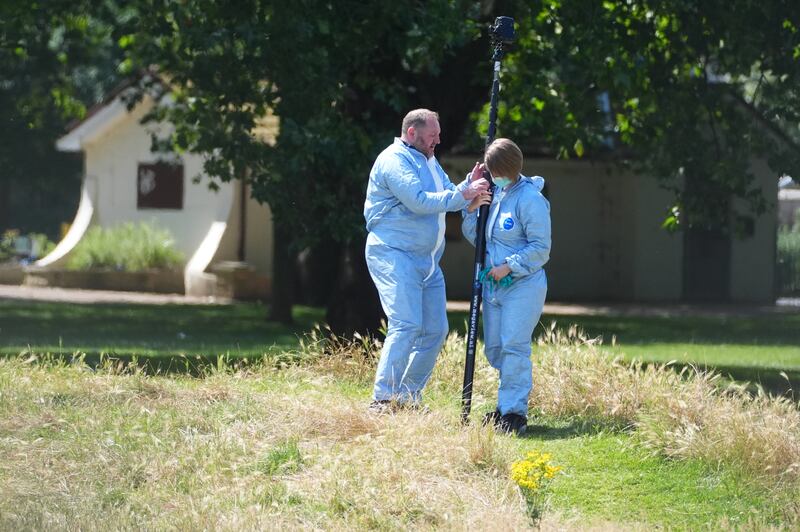 Crime scene officers gather evidence at Plashet Park