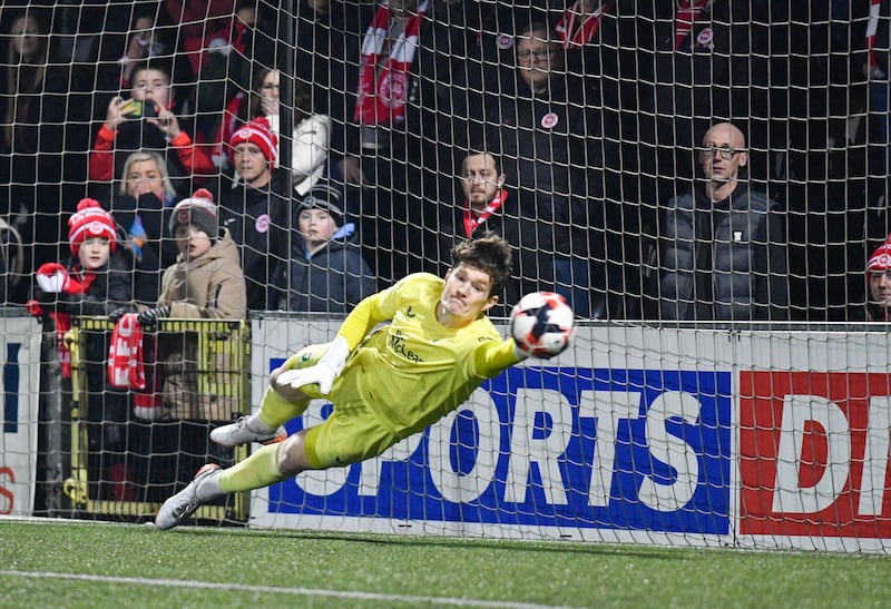 Andrew Mills saves the penalty to Win Glentoran the Shield during this evening’s Co Antrim Shield final