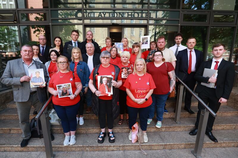 Members of Northern Ireland Covid-19 Bereaved Families for Justice hold a press conference outside the Clayton Hotel in Belfast