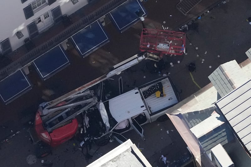 Investigators at the scene after a person drove a vehicle into a crowd earlier on Canal and Bourbon Street in New Orleans (Gerald Herbert/AP)