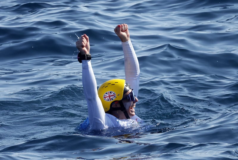 Great Britain’s Ellie Aldridge celebrates winning gold