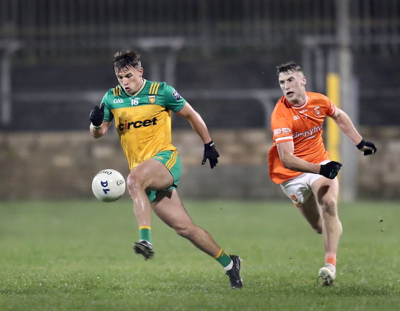 Caolan McGonagle with Joe Sheridan of Armagh during the McKenna Cup match played at Ballybofey on Wednesday night.   3-1-2024