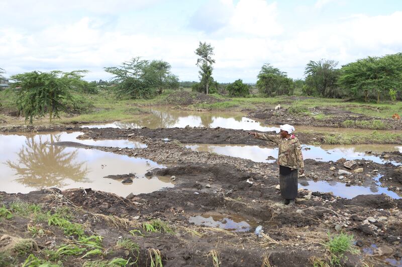 Martha Waema, in her three-acre farm that was submerged by weeks of rainfall (Andrew Kasuku/AP)