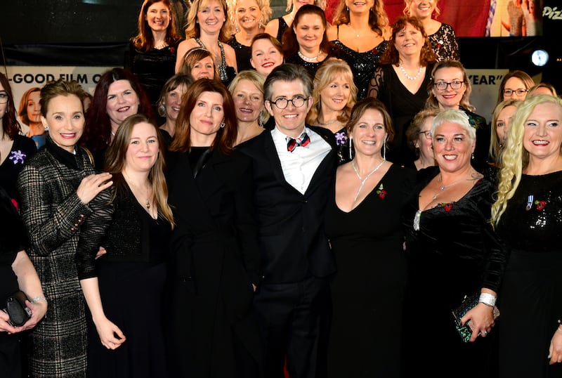 Dame Kristin Scott Thomas, Gareth Malone and Sharon Horgan with the Combined Military Wives Choir attending the premiere of the film Military Wives in 2020