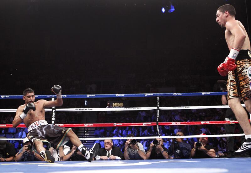 Amir Khan lost to Danny Garcia by a fourth-round stoppage in their WBA and WBC light-welterweight unification fight in Las Vegas.&nbsp;