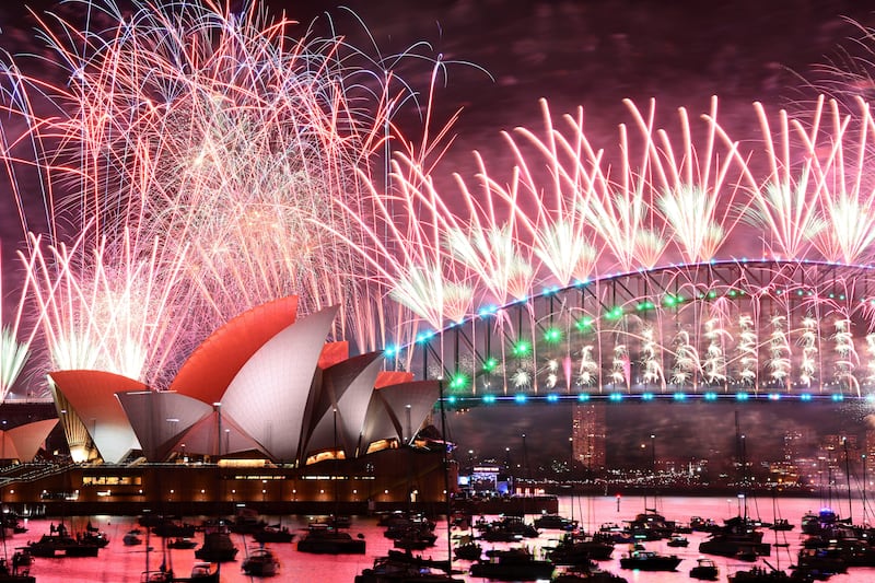 Fireworks explode over the Sydney Opera House and on the Harbour Bridge as part of New Year’s Eve celebrations in Sydney (Dan Himbrechts/AAP Image via AP)