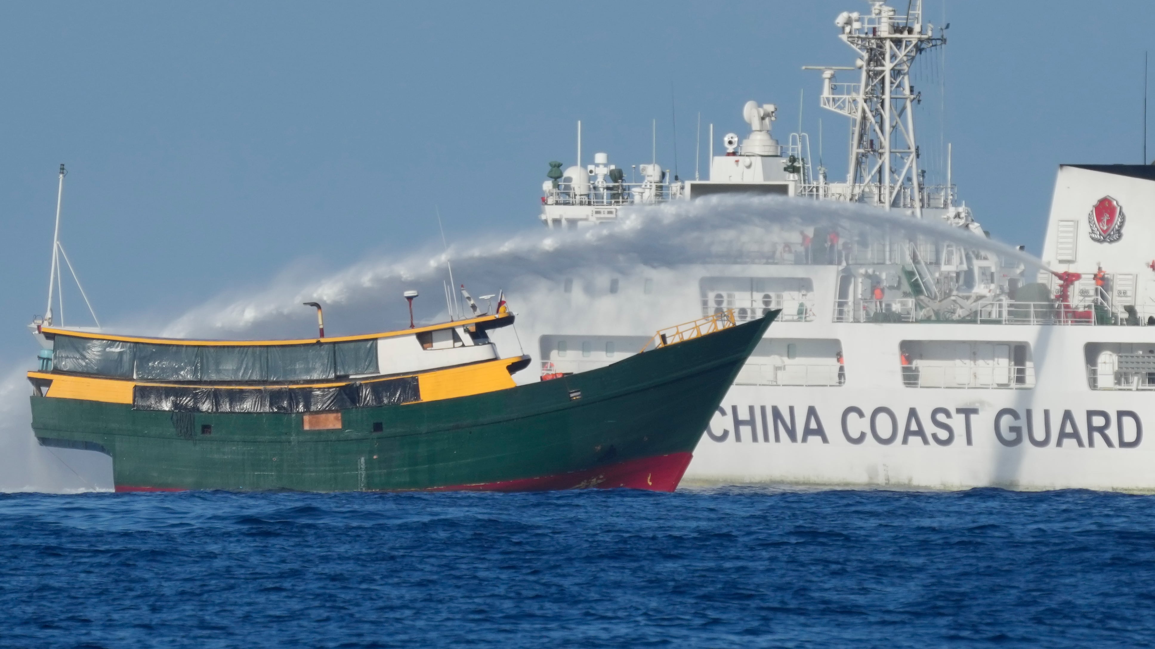 Philippine resupply vessel Unaizah May 4 is hit by Chinese coast guard water canon blast causing injuries to multiple crew members as they tried to enter the Second Thomas Shoal (Aaron Favila/AP)