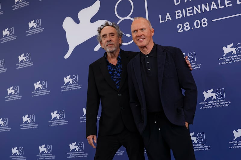 Tim Burton and Michael Keaton posed together on the red carpet (Joel C Ryan/AP)