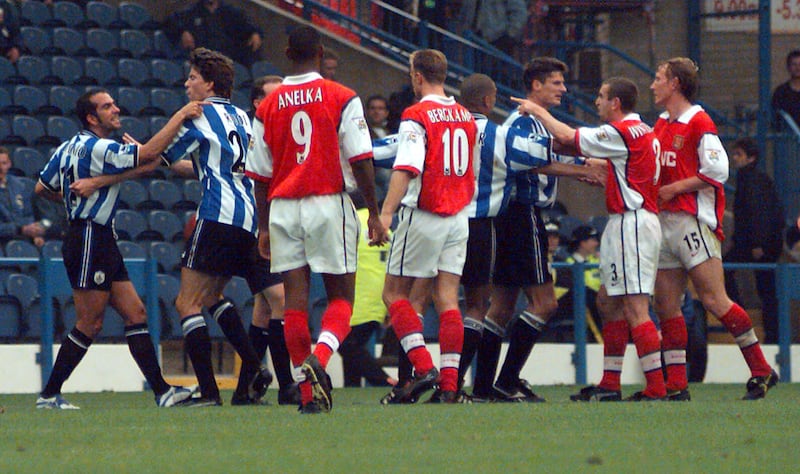 Paolo Di Canio, far left, reacted to a red card by pushing referee Paul Alcock