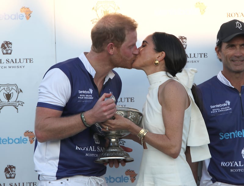 Harry and Meghan kiss at the polo match – a scene which features in the series