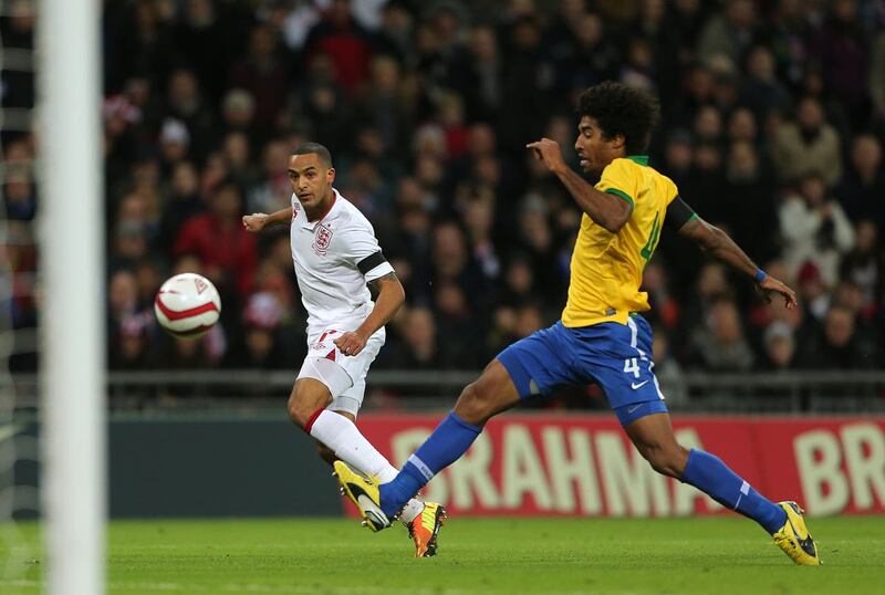 Brazil’s Dante attempts to block a shot by England’s Theo Walcott