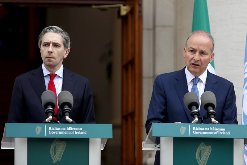Mr Harris and Tanaiste Micheal Martin speaking to the media during a press conference outside the Government Buildings, Dublin