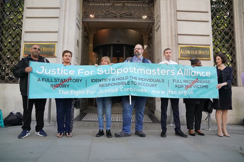 Members of the Justice For Subpostmaster Alliance protest outside Aldwych House in central London