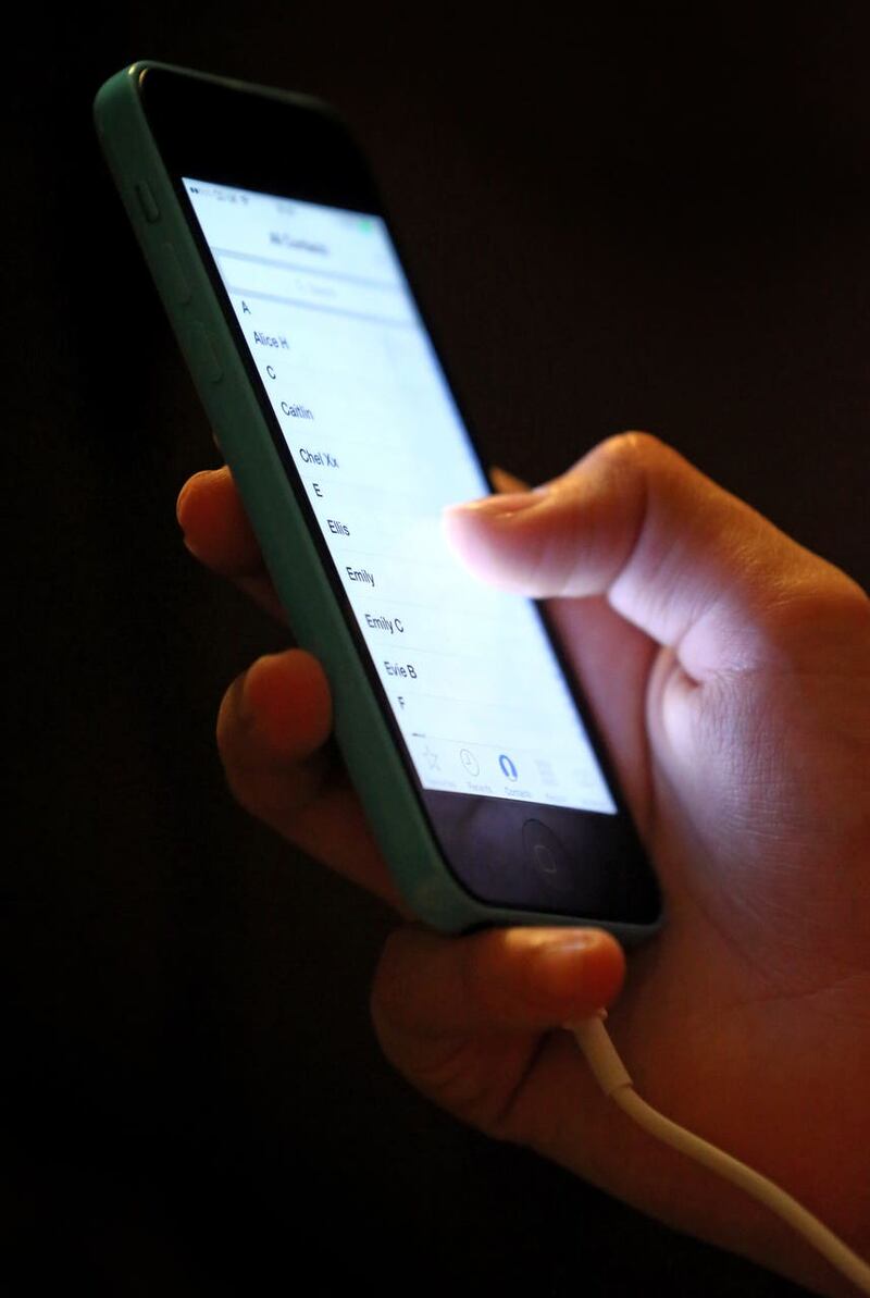 A teenage girl using a mobile phone (Chris Radburn/PA)