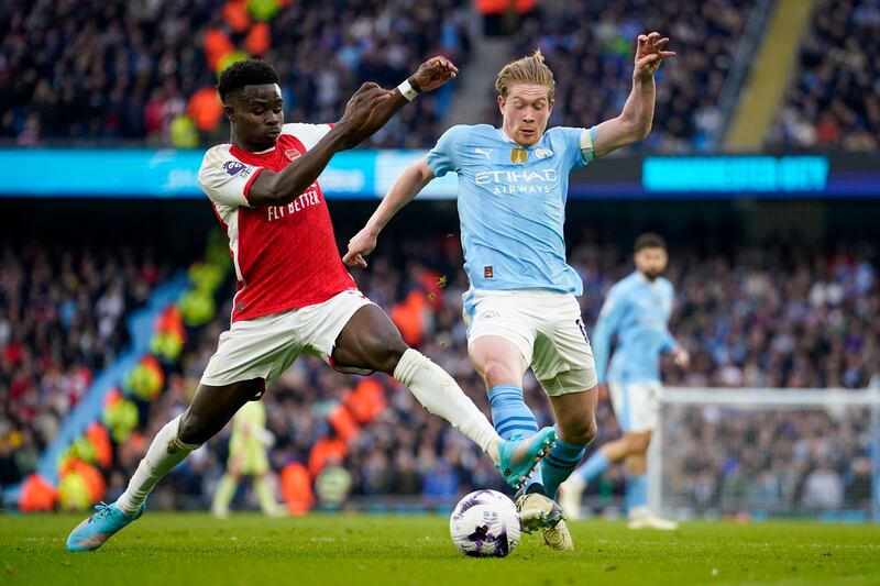 Bukayo Saka (left) limped off against Manchester City on Sunday (AP/Dave Thompson)