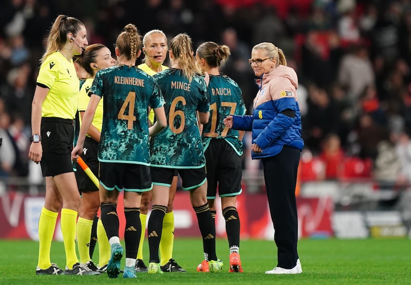 Sarina Wiegman, right, congratulates the Germany players after their win at Wembley