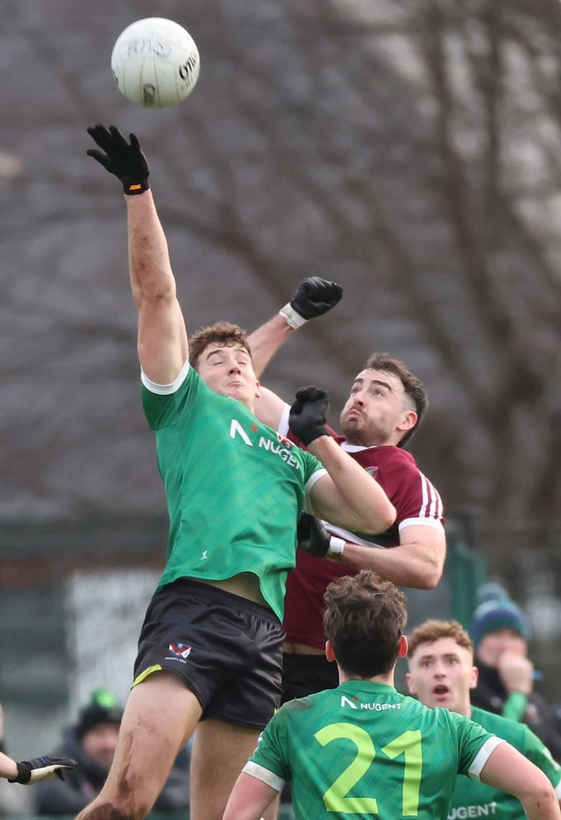 Declan Loye (right) battles for midfield possession for St Mary's against Queen's in the Sigerson Cup.