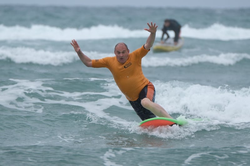 Sir Ed Davey learning to surf near Bude, Cornwall