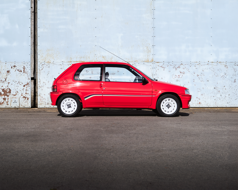 The Rallye’s red interior carpets, racing stripes and simple white steel wheels are typically of their era (Hagerty)