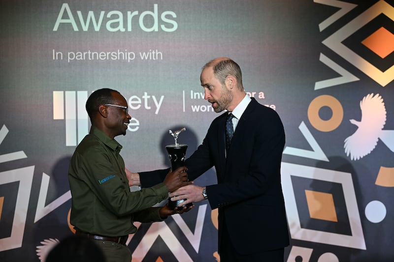 William presents the Tusk wildlife ranger award to Claver Ntoyinkima