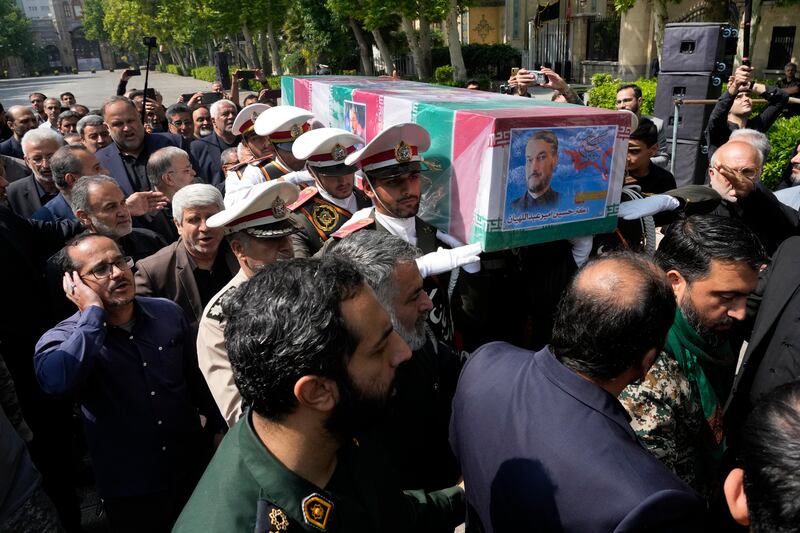 Army members carry the flag-draped coffin of Iranian foreign minister Hossein Amirabdollahian (AP Photo/Vahid Salemi)