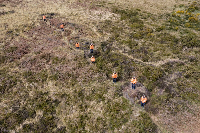 Oblique aerial view of a practice trench from the south-east, with multiple occurrences of the same figure digitally superimposed to show its line.