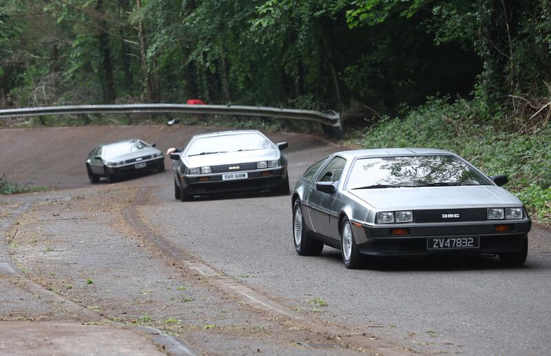 DeLorean owners gather at the Cutts in Dunmurry on Sunday as they drive on the old test track as part of the DeLorean Revival in Belfast.
PICTURE COLM LENAGHAN