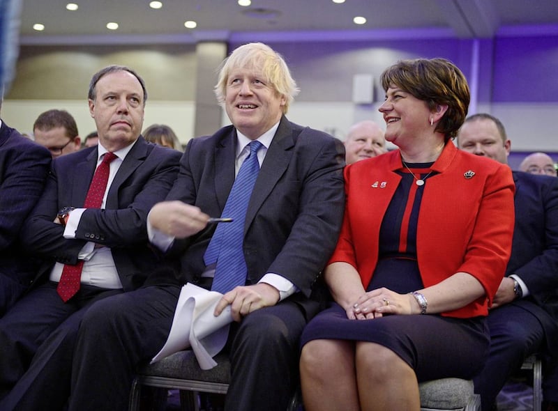 Boris Johnson with former DUP leader Arlene Foster and former deputy leader Nigel Dodds at the party&#39;s annual conference in Belfast in 2018. Picture by Arthur Allison/Pacemaker Press 