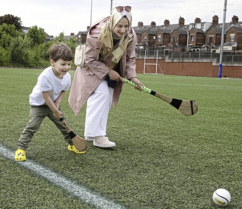 Hamza Ustundag (4) and his mother Zuhal enjoy some Gaelic games at Fennell Park at teh weekend. Picture by Hugh Russell. 