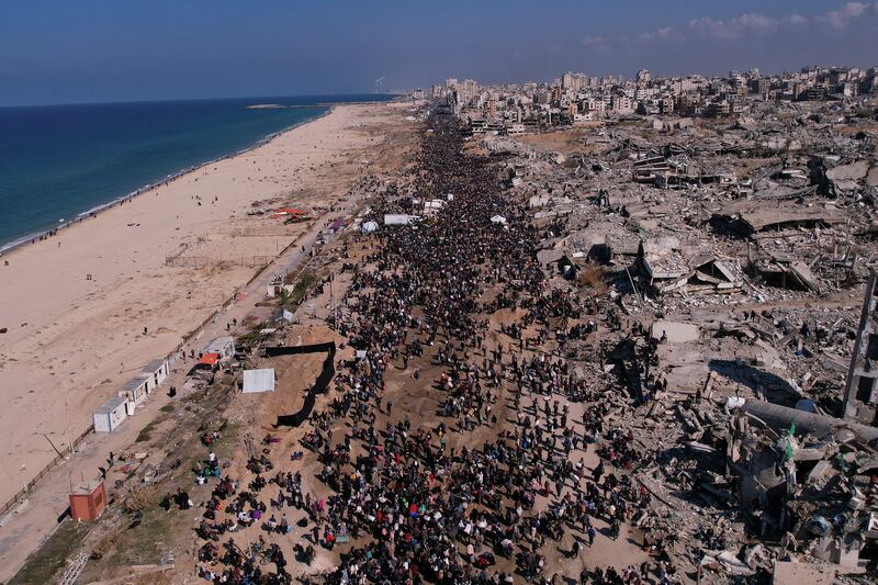 Displaced Palestinians return to their homes in the northern Gaza Strip (Mohammad Abu Samra/AP)