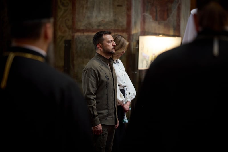 Volodymyr Zelensky and wife Olena attend a service in Saint Sophia Cathedral during celebration of Ukrainian Independence Day (Ukrainian Presidential Press Office/AP)