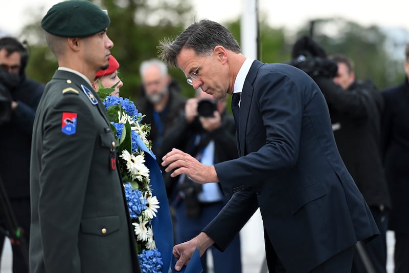 Mark Rutte lay a wreath during the ceremony at Nato headquarters (Harry Nakos/AP)