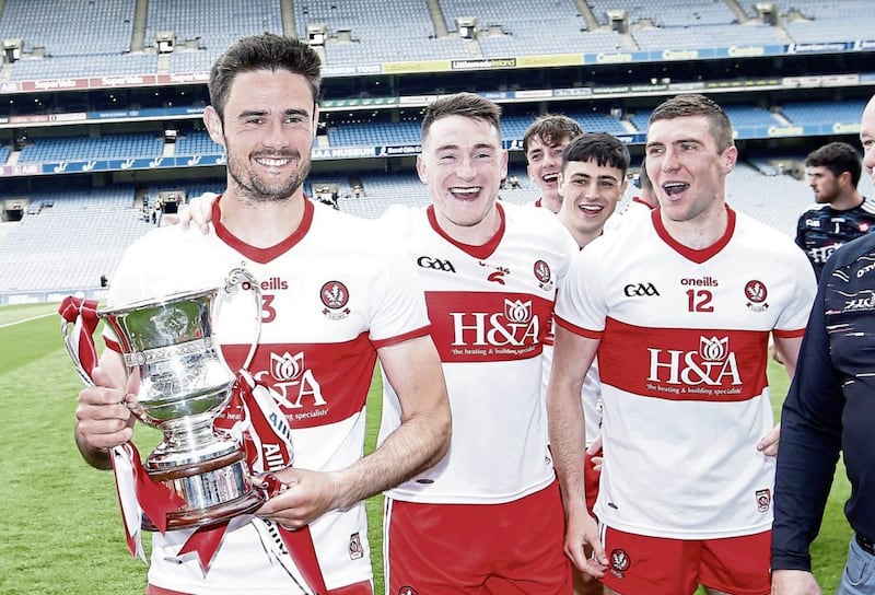 Chrissy McKaigue, Gareth McKinless and Ciaran McFaul celebrate after Derry&#39;s Division Three success on Saturday. Picture by Philip Walsh 