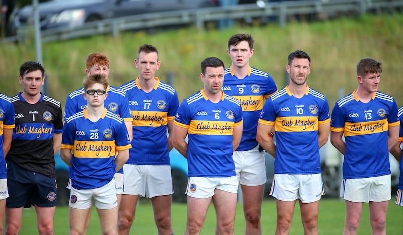 Maghrey’s stand for a minute silence in respect to Crossmaglem’s Caolan Finnegan  during Saturday’s  Championship game in Maghery.
PICTURE COLM LENAGHAN