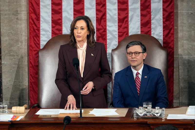 Vice President Kamala Harris reads the results as House Speaker Mike Johnson listens during a joint session of Congress (Matt Rourke/AP)