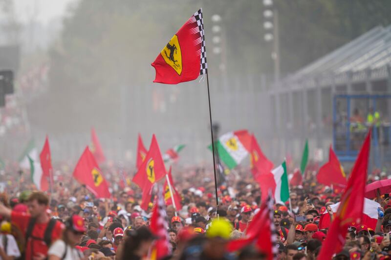 Ferrari fans celebrated Leclerc’s victory at Monza (Luca Bruno/AP)