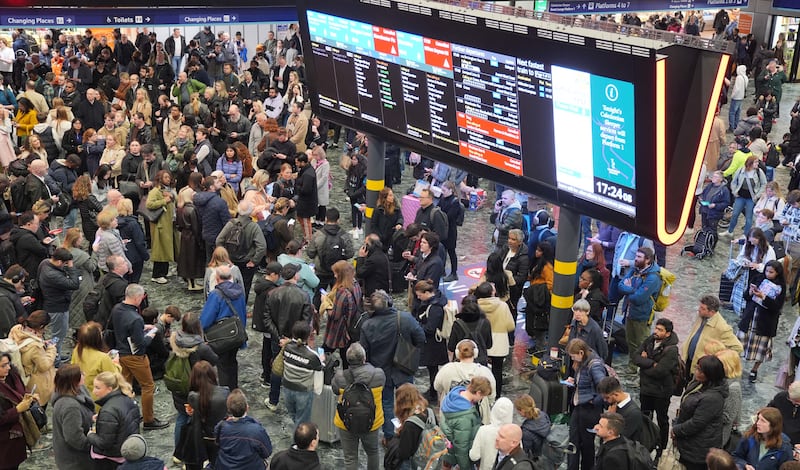 A crowd of passengers at Euston station in London