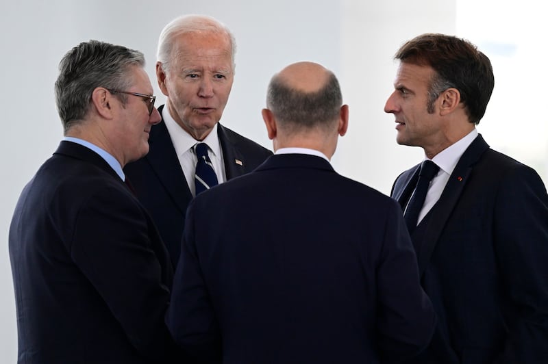 The four leaders speak before attending their Quad meeting at the Chancellery in Berlin (John Macdougall/Pool Photo via AP)