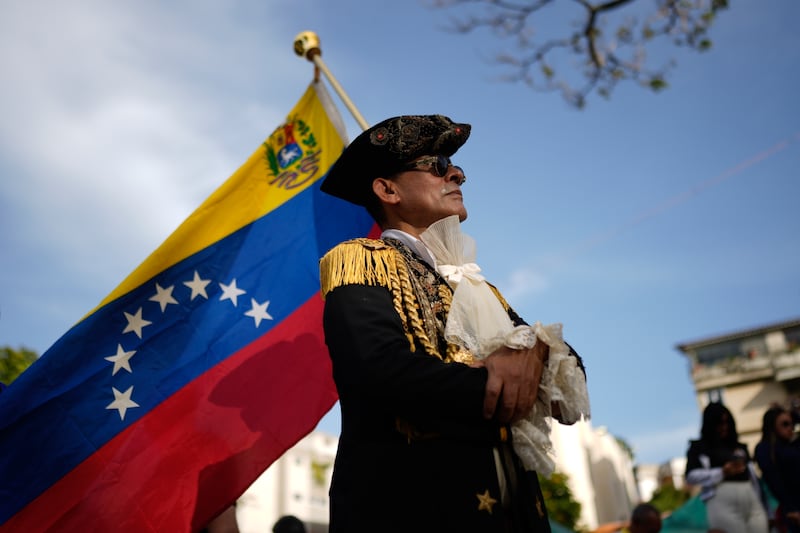 A man dressed as an Independence fighter attends a campaign event with opposition presidential candidate Edmundo Gonzalez in Caracas (Ariana Cubillos/AP)